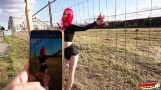 Redhead teen posing by fence xxx scene